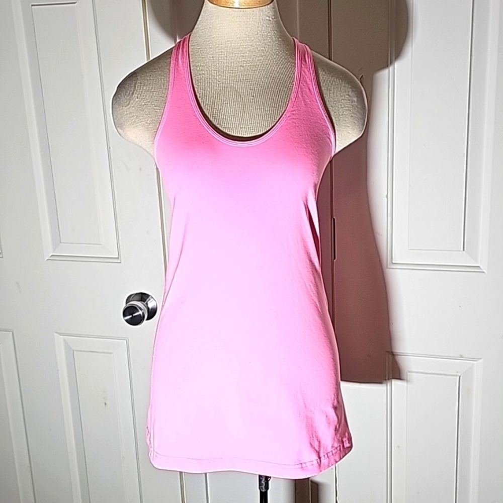 Lululemon pink razor back tank top. Very good used condition. Size 8.